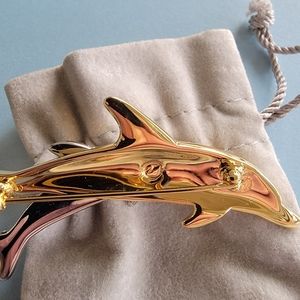 Swarovski crystal dolphins pin. Retired long ago.